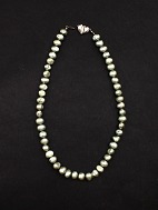 Pearl chain with heart-shaped lock