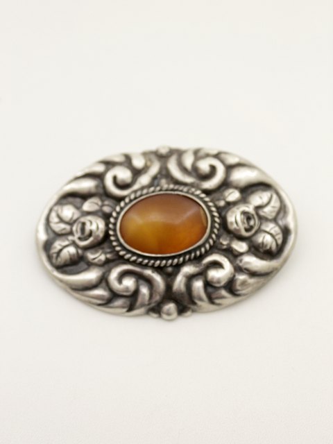 Silver brooch 6 x 4 cm. with amber sold