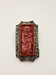 Brooch 4 x 2.4 cm. lacquer surrounded by filigree